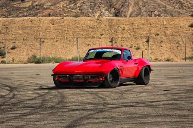 007-brian-hobaugh-1965-corvette-red-falken-rt615k-super-chevy-suspension-challenge-front-three-quarter